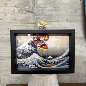 Cholo Riding Surf on Hokusai’s Wave Art Framed